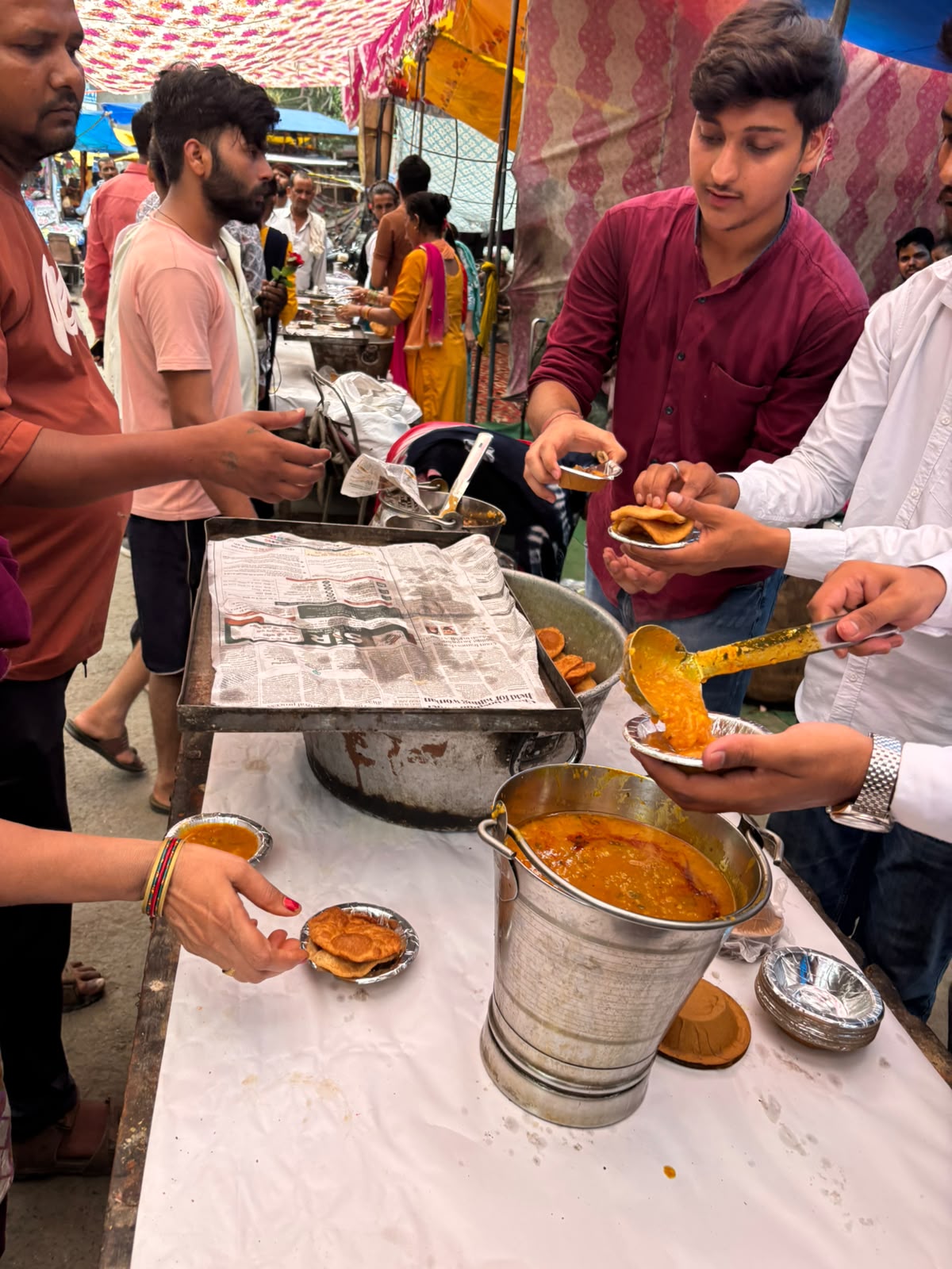 Volunteers packing meal parcels ahead of the Delhi food distribution drive, 4 July 2026